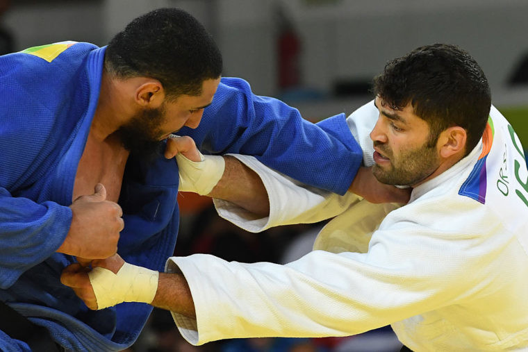 Egypt's Islam El Shehaby competes against Israel's Or Sasson during the men's +100kg judo contest match