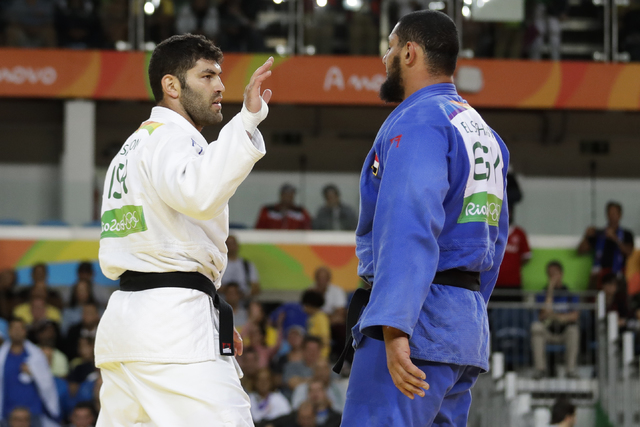 ASSOCIATED PRESS           Egypt’s Islam El Shehaby blue declined to shake hands with Israel’s Or Sasson white after losing during the men’s over 100-kg judo competition at the 2016 Summer Olympics in Rio de Janeiro Brazil