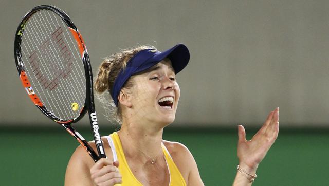 Elina Svitolina of Ukraine celebrates after winning her match against Serena Williams