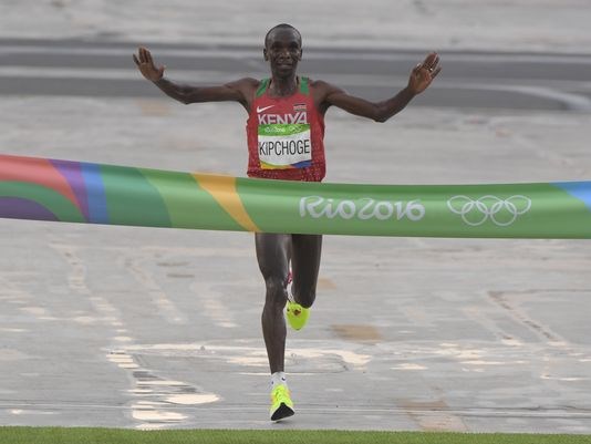 Eliud Kipchoge of Kenya crosses the finish line in the marathon