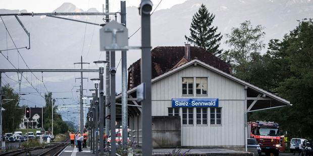 Emergency services attend the scene at Salez- Sennwald train station after a man attacked other passengers aboard a train