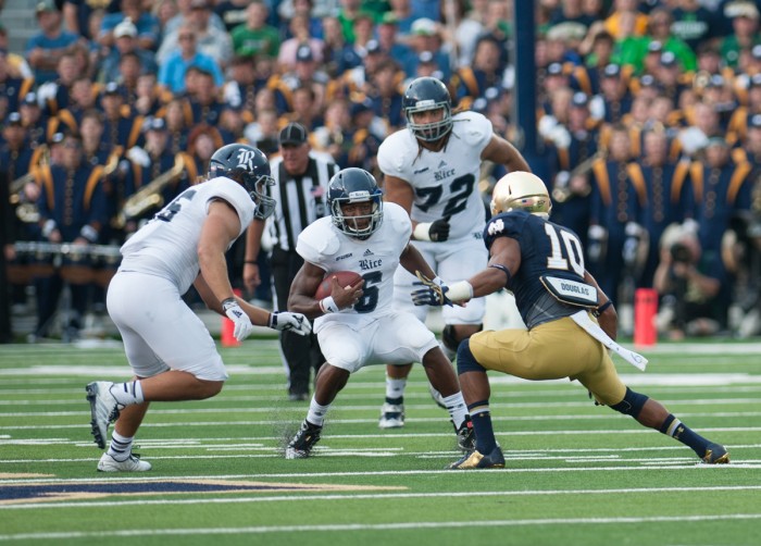 Irish senior safety Max Redfield prepares to tackle the ballcarrier in Notre Dame's 48-17 win over Rice on Aug. 30 2014. Redfield was dismissed from the team Sunday following his arrest late Friday night