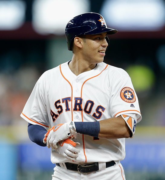 HOUSTON TX- AUGUST 04 Carlos Correa #1 of the Houston Astros smiles after he robbed of a hit by Jose Bautista #19 of the Toronto Blue Jays in the second inning at Minute Maid Park