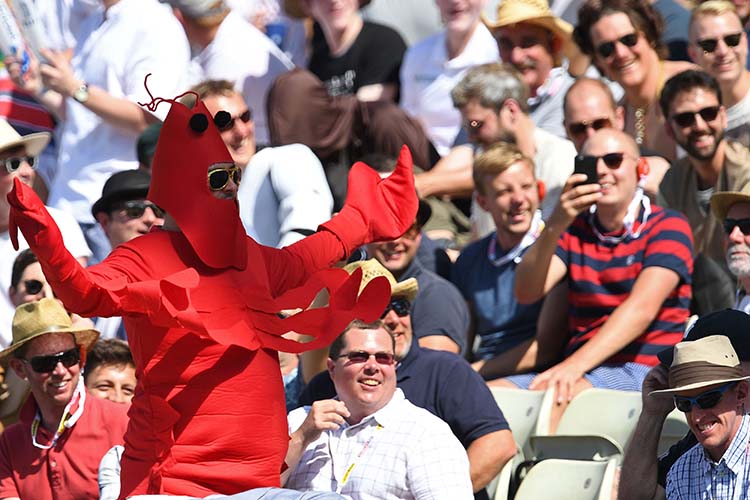 The fans here can be found sporting yellow and red but they are not the egg and tomato of the MCC tie these are those of a giant lobster suit