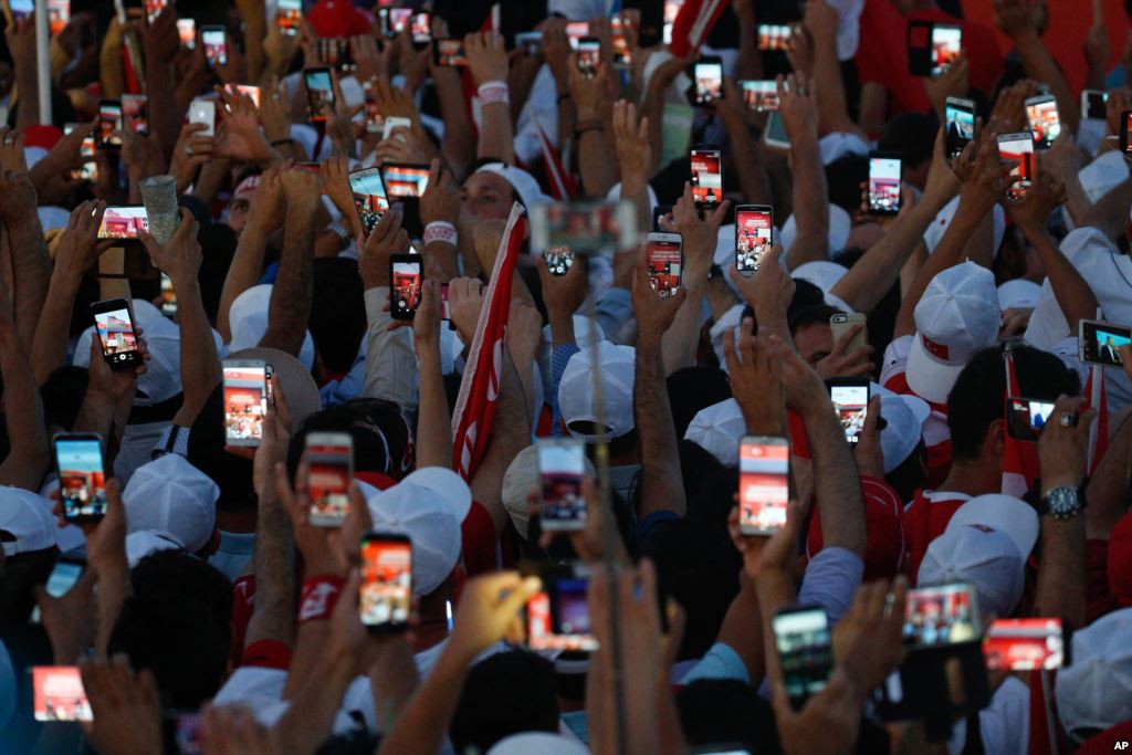 Turkish people use their cell phones to take images before the speech of President Recep Tayyip Erdogan at the Democracy and Martyrs&#39 Rally in Istanbul Aug. 7 2016