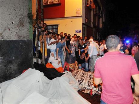 People react after an explosion in Gaziantep southeastern Turkey early Sunday Aug. 21 2016. Gaziantep Province Gov. Ali Yerlikaya said the deadly blast during a wedding near the border with Syria was a terror attack