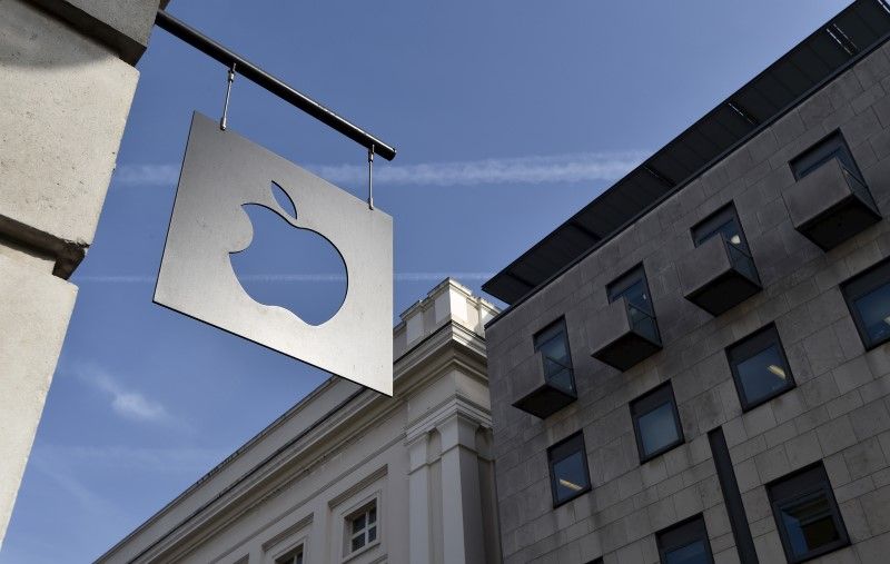 A sign is seen outside the Apple Store in Covent Garden in London