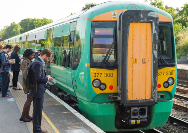 Southern rail train at Honor Oak Park station in London as Southern Railway called for fresh talks to try to resolve a bitter row over the role of conductors as a second day of strike action caused more travel misery for