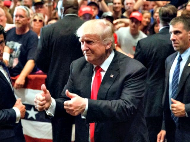 Republican presidential candidate Donald Trump gives a thumbs up as he leaves a campaign rally Friday Aug. 12 2016 in Altoona Pa