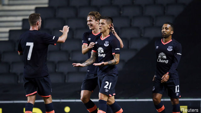 Everton's Muhamed Besic celebrates after scoring their third goal