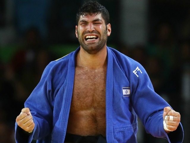 RIO DE JANEIRO BRAZIL- AUGUST 12 Or Sasson of Israel celebrates after defeating Alex Garcia Mendoza of Cuba during the Men's +100kg Judo contest on Day 7 of the Rio 2016 Olympic Games at Carioca Arena 2