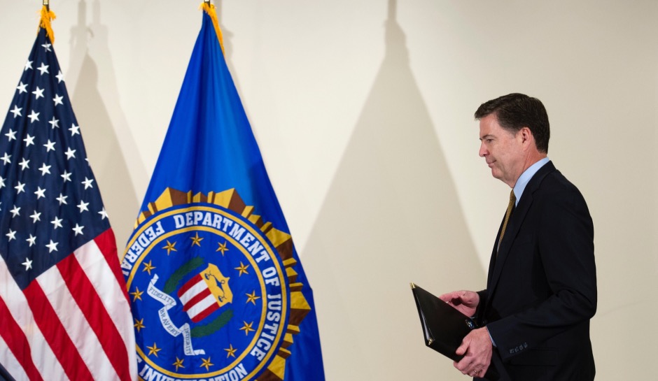 FBI Director James Comey approaches podium inside FBI Headquarters on July 5 to deliver statement on Clinton emails