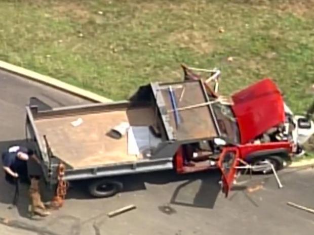 1 Injured As Truck Crashes Through Gates Of FBI Building On South Side