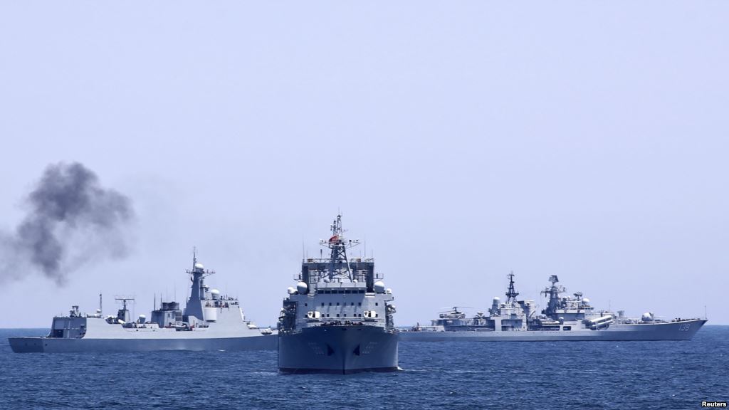 FILE- Chinese and Russian naval vessels are seen during a 2014 joint naval exercise outside Shanghai on the East China Sea