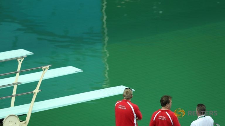 Olympics-Diving-Swimming pool's green hue stokes puzzlement