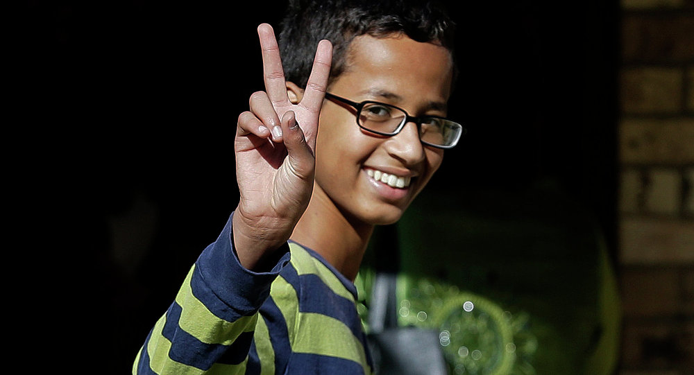 Ahmed Mohamed gestures as he arrives to his family's home in Irving Texas