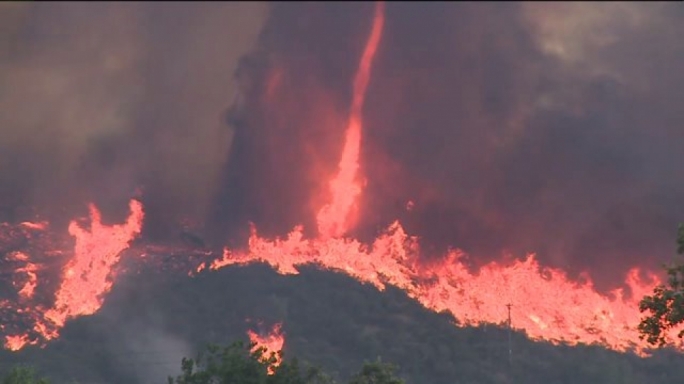 Fanned by strong winds and high temperatures the wildfire escaladed into fire tornados