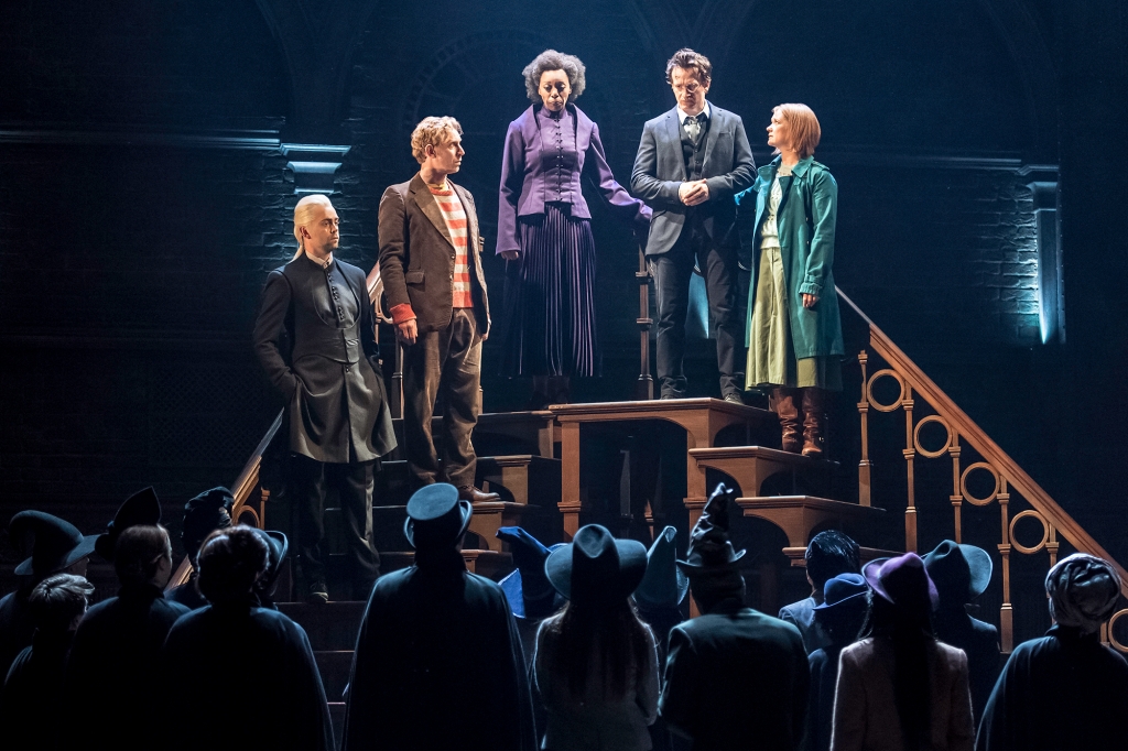 From left Alex Price as Draco Malfoy Paul Thornley as Ron Weasley Noma Dumezweni as Hermione Granger Jamie Parker as Harry Potter and Poppy Miller as Ginny Potter in Harry Potter and the Cursed Child