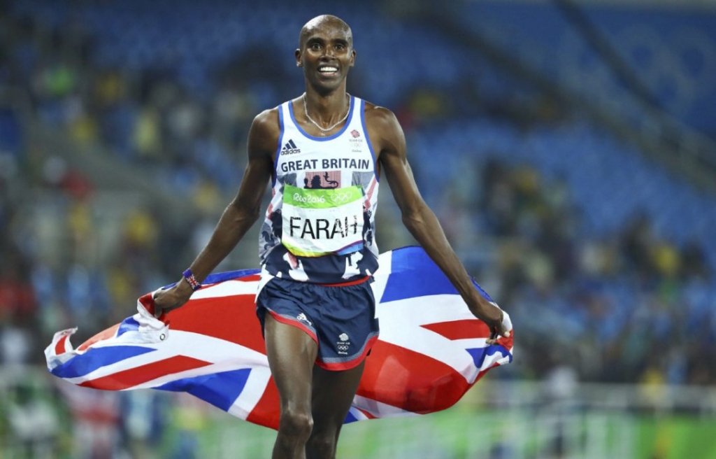 Mo Farah of Britain celebrates winning the gold in the men's 5000m race