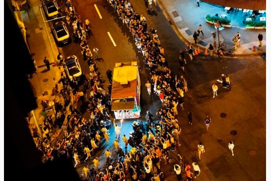 The Olympic torch is carried through the streets of Copacabana as the torch relay continues on its journey to the opening ceremony of the 2016 Summer Olympics in Rio de Janeiro Brazil early Friday Aug. 5 2016