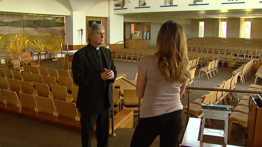 Father Kevin Burke is interviewed by CBS4's Jennifer Brice