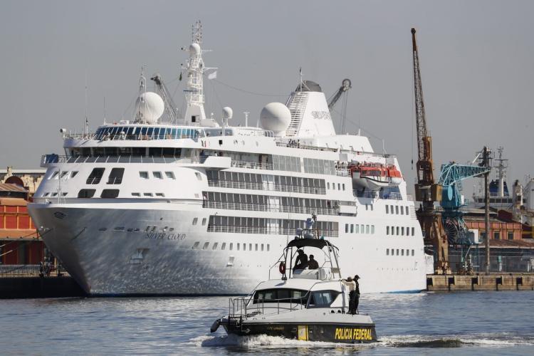 Federal police patrol in front of the Silver Cloud liner in Rio de Janeiro Brazil on Monday