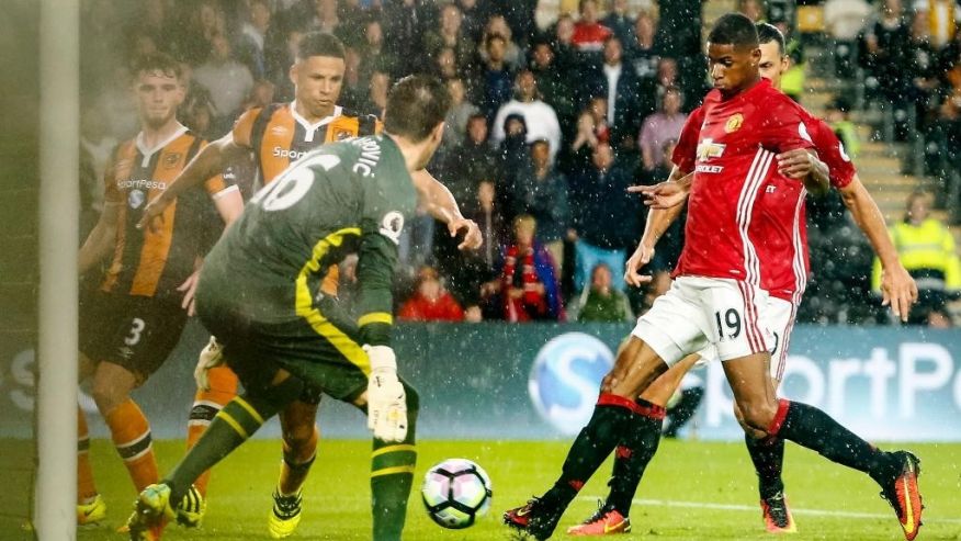 Manchester United's Marcus Rashford right scores the only goal of the game during the Premier League soccer match Hull City versus Manchester United at the KCOM Stadium Hull England Saturday Aug 27 2016