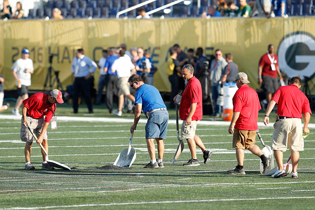 CANTON OH- AUGUST 07 Crews work on the field prior to the NFL Hall of Fame Game between the Green Bay Packers and Indianapolis Colts at Tom Benson Hall of Fame Stadium