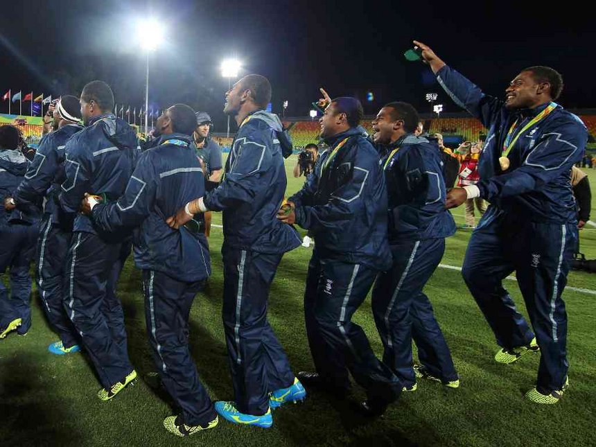 Fiji's players celebrate with their gold medals during the 2016 Rio Olympics at Deodoro Stadium in Rio de Janeiro Brazil