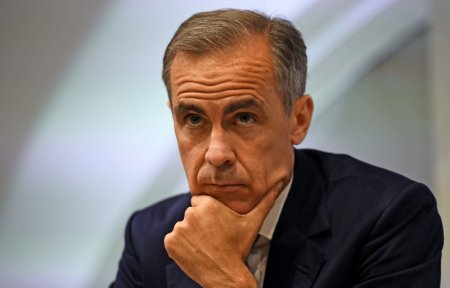 Bank of England governor Mark Carney pauses as he speaks during a news conference at the Bank of England in London Britain