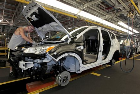 Louisville Assembly Plant employees work to assemble the new 2013 Ford Escape on the production line in Louisville Kentucky