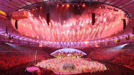 Fireworks go off as performers dance during the opening ceremony of the 2016 Summer Olympics in Rio Brazil