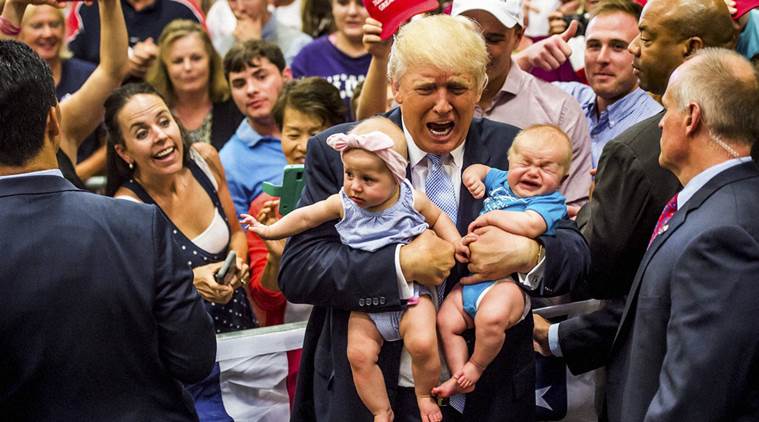 Republican presidential candidate Donald Trump holds baby cousins Evelyn Kate Keane 6 months old and Kellen Campbell 3 months old following his speech at the Gallogly Events Center at University of Colorado Colorado Springs Friday