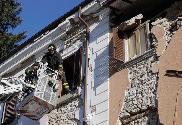 Firefighters inspect a damaged house in Sant'Angelo near Amatrice on Thursday. AP