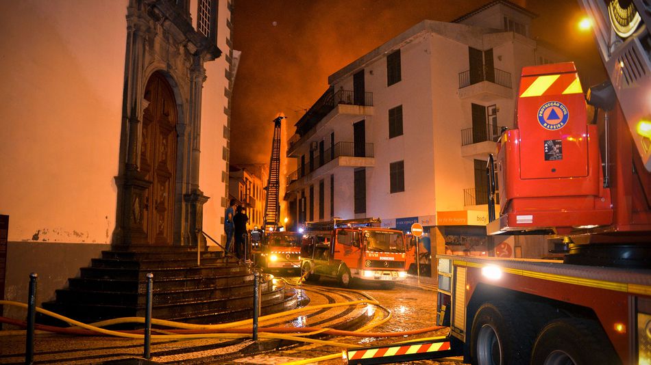 Firefighting vehicles line the street in the historical center of Funchal in Madeira island