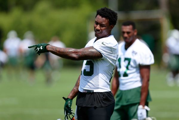 Jets receiver Brandon Marshall gives advice to another