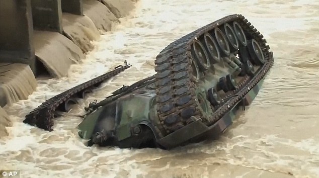 Five soldiers were in the tank when it slipped from the bridge and plunged into the river