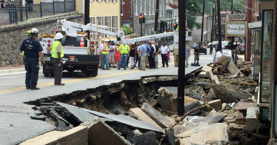 WATCH: Men form human chain to save woman from Maryland floods