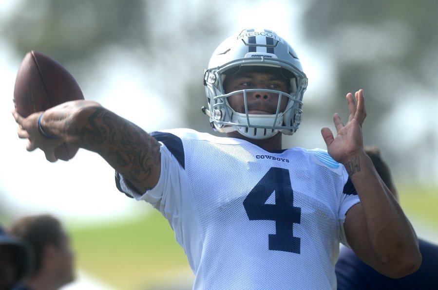 CHUCK KIRMAN  THE STAR Quarterback Dak Prescott makes a throw during Cowboys practice at Oxnard on Thursday. The fourth-round draft pick led the first-team offense with starter Tony Romo taking the day off