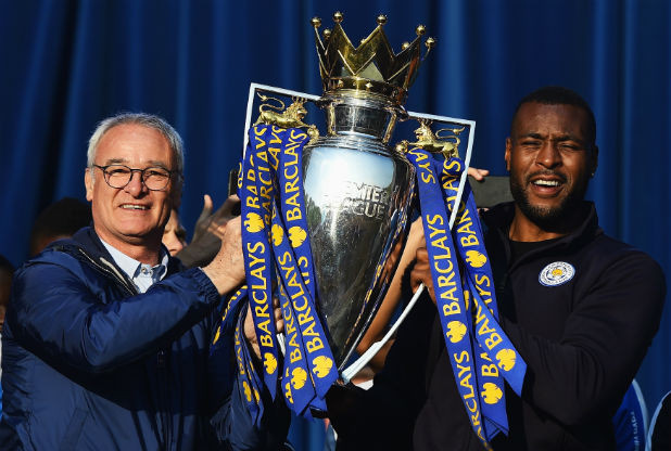 Former Nottingham Forest star Wes Morgan right holds the Premier League trophy with manager Claudio Ranieri last May