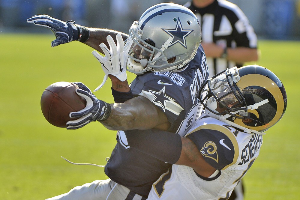 Dallas Cowboys wide receiver Dez Bryant left makes a touchdown catch over Los Angeles Rams defensive back Coty Sensabaugh during the first quarter in a preseason game on Saturday Aug. 13 2016 at the Coliseum in Los Angeles