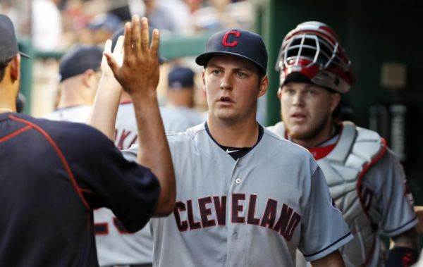 Cleveland Indians starting pitcher Trevor Bauer center celebrates