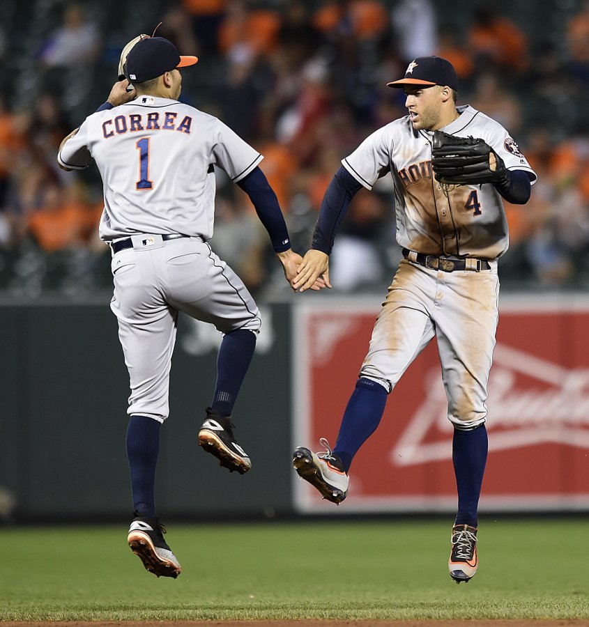 GAIL BURTON  AP The Houston Astros Carlos Correa left and George Springer celebrate the team's 15-8 win over the Baltimore Orioles on Friday