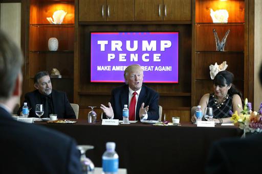 Republican presidential candidate Donald Trump leads a Hispanic leaders and small business owners roundtable in Las Vegas Friday Aug. 26 2016. Left is Pastor Pasqual Urrabazo of the International Church of Las Vegas and right is Irma Aguirre a local