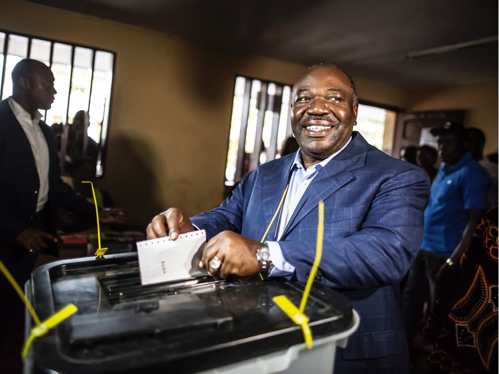 Gabonese President Ali Bongo Ondimba arrives to cast his vote at a polling station during the presidential election on Saturday Aug. 27 2016 in Libreville