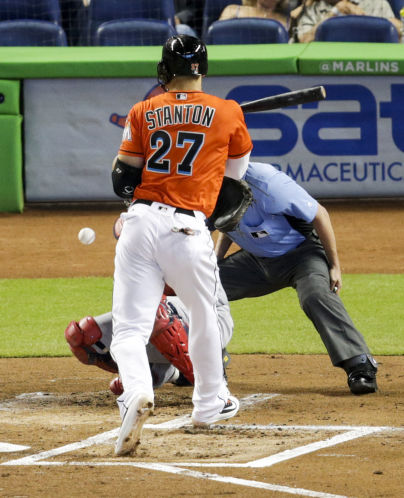 Marlins slugger Giancarlo Stanton tries and fails to get out of the way of a pitch from Cardinals starter Carlos Martinez in the second inning