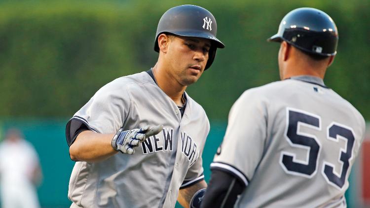 Gary Sanchez is congratulated by coach Joe Espada as he circles the bases on a solo home run against the Los Angeles Angels