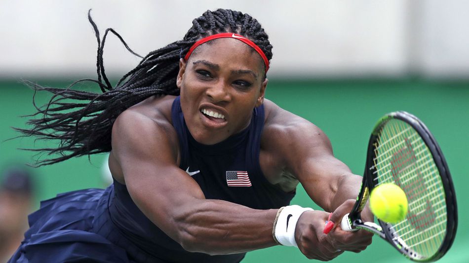 Serena Williams of the United States reaches for a return against Daria Gavrilova of Australia at the 2016 Summer Olympics in Rio de Janeiro Brazil