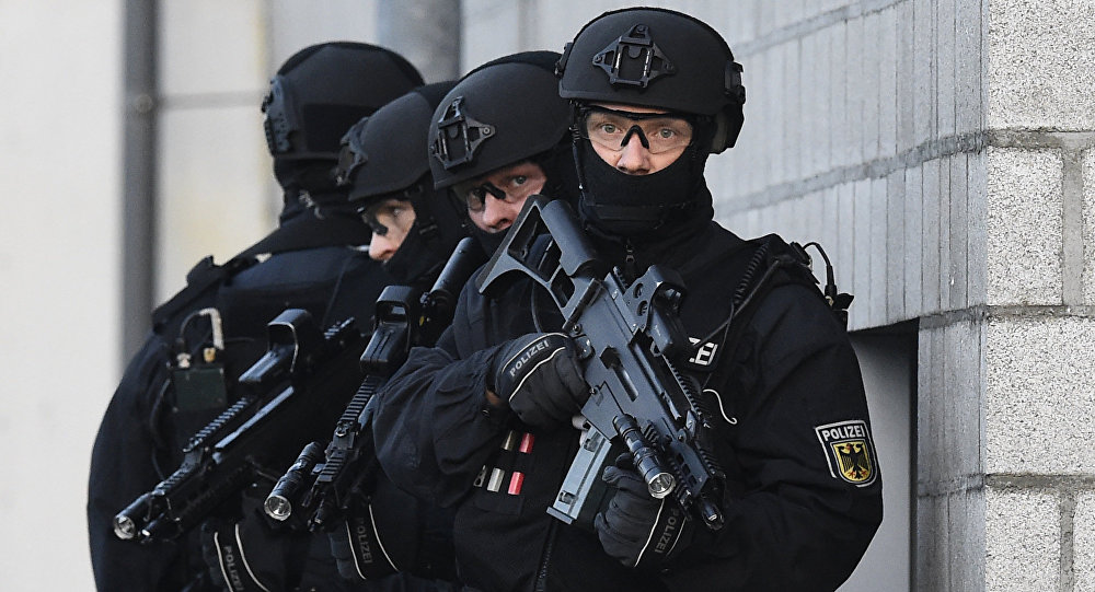 Members of the German police's so-called BFE+ anti-terror unit present a training operation in Berlin's Ahrensfelde district