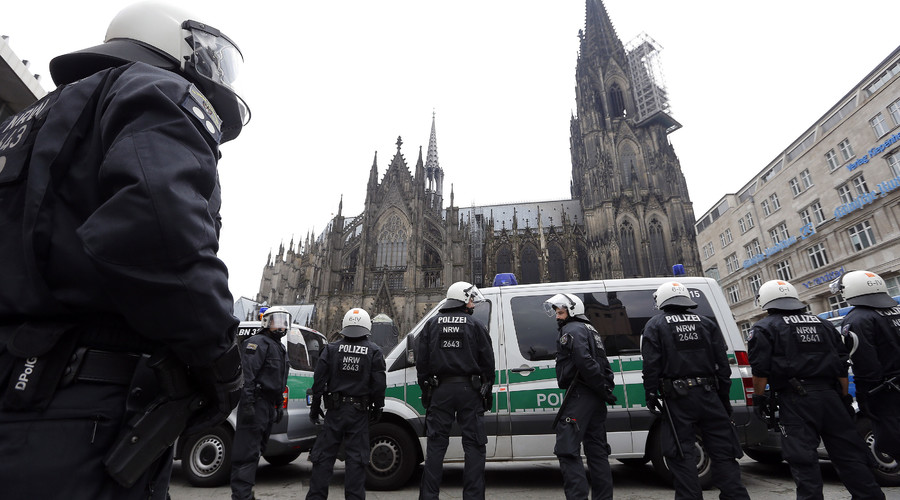 German riot police stand in front of the Cologne Cathedral in Cologne Germany